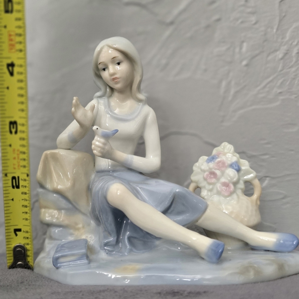 Royal Heritage - Girl with bird and basket of flowers porcelain figurine (T121)